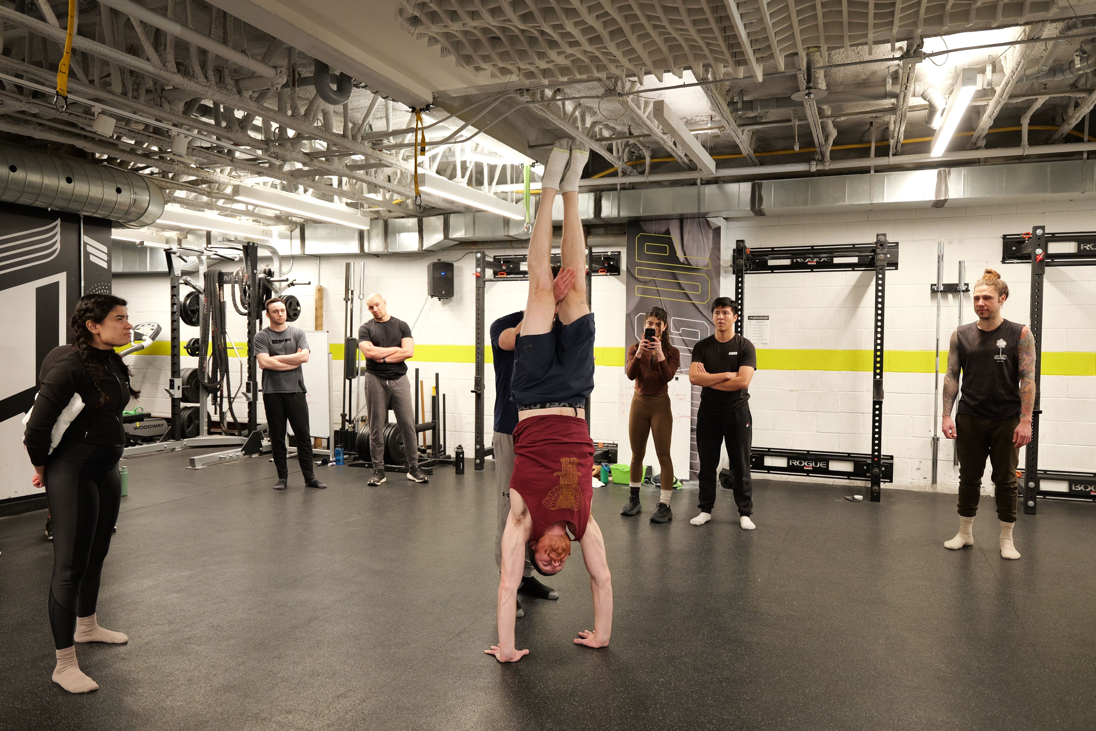 Clean freestanding handstand — the whole room holding their breath
