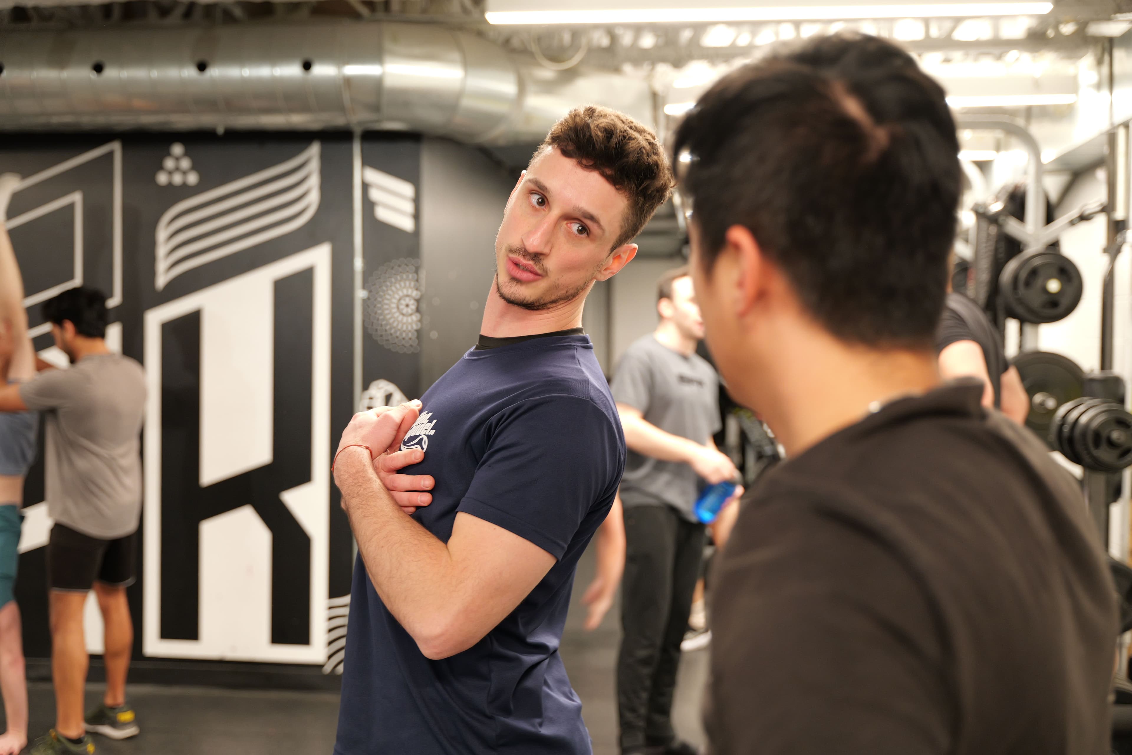 Jonny coaching one-on-one, eyes open, engaged
